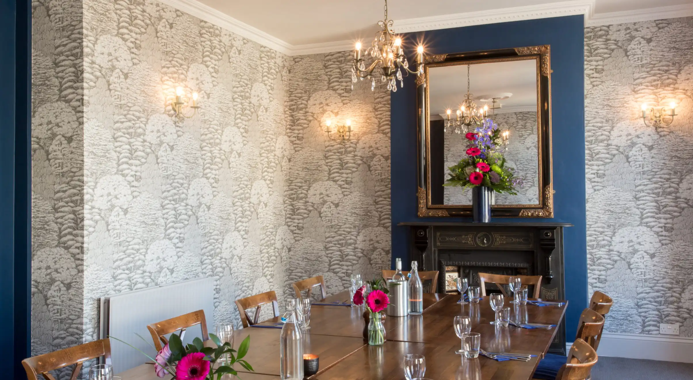 Tables arranged in the upstairs private dining room at The Strand