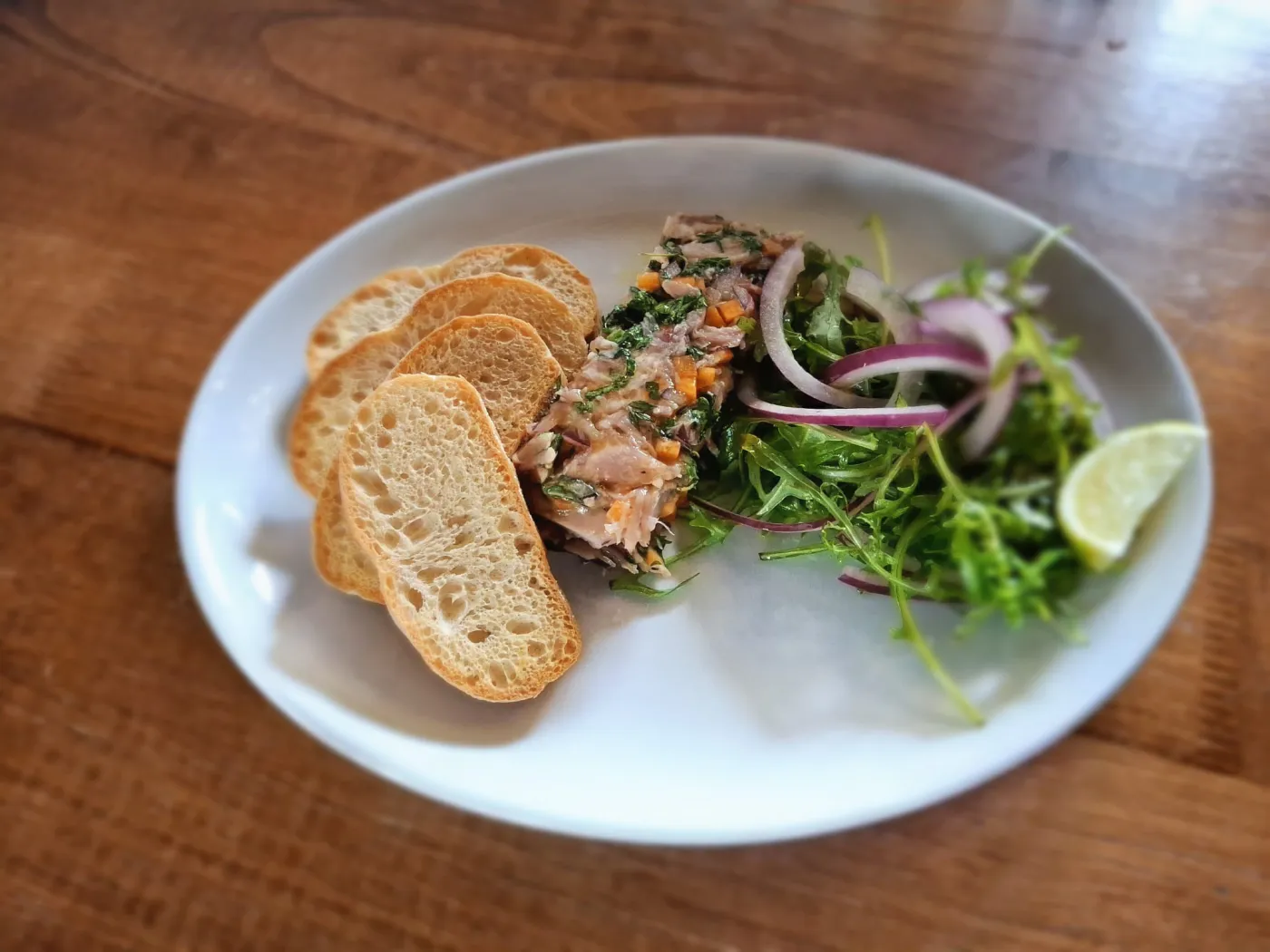 Ham hock terrine with bread and salad at The Strand